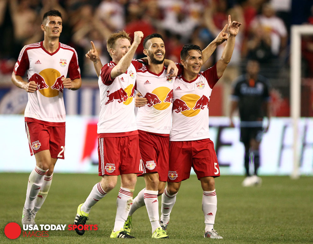 Aug 9, 2015; Harrison, NJ, USA; New York Red Bulls midfielder Felipe Martins (8) celebrates his goal with defender Connor Lade (5) and midfielder Dax McCarty (11) against New York City FC during the second half at Red Bull Arena. Mandatory Credit: Danny Wild-USA TODAY Sports